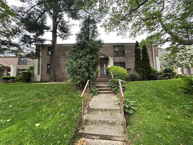 18 Terrace Cir Unit 9C & 11C, Great Neck, NY 11021 - view of front of property featuring brick siding and a front lawn