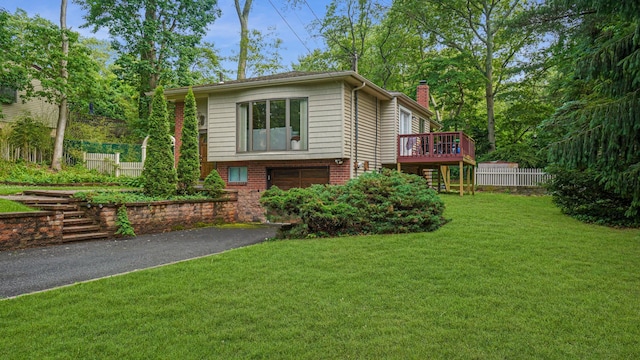 6 Sycamore Pl, Smithtown, NY 11787 - view of front of home with a chimney, a garage, driveway, a deck, and brick siding