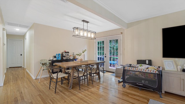 6 Sycamore Pl, Smithtown, NY 11787 - dining area featuring french doors, light wood-style floors, and crown molding
