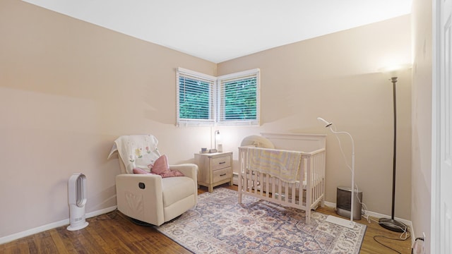 6 Sycamore Pl, Smithtown, NY 11787 - bedroom featuring wood finished floors and a nursery area
