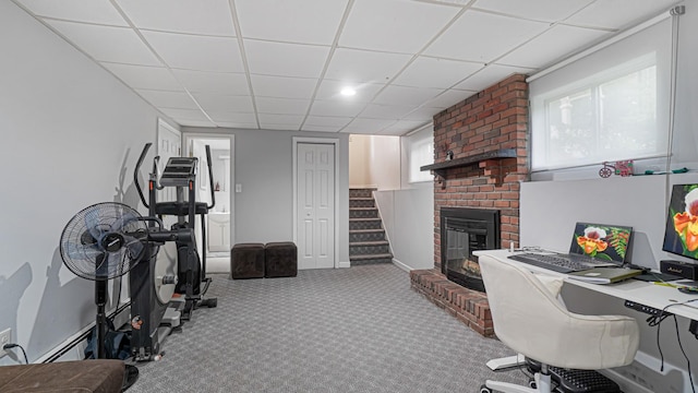 6 Sycamore Pl, Smithtown, NY 11787 - carpeted home office with a paneled ceiling and a brick fireplace