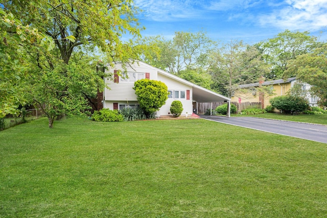 9 Laurie Rd, Brentwood, NY 11717 - view of front of home featuring driveway and an attached carport