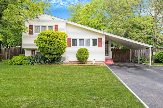 9 Laurie Rd, Brentwood, NY 11717 - view of front of house featuring asphalt driveway and a carport