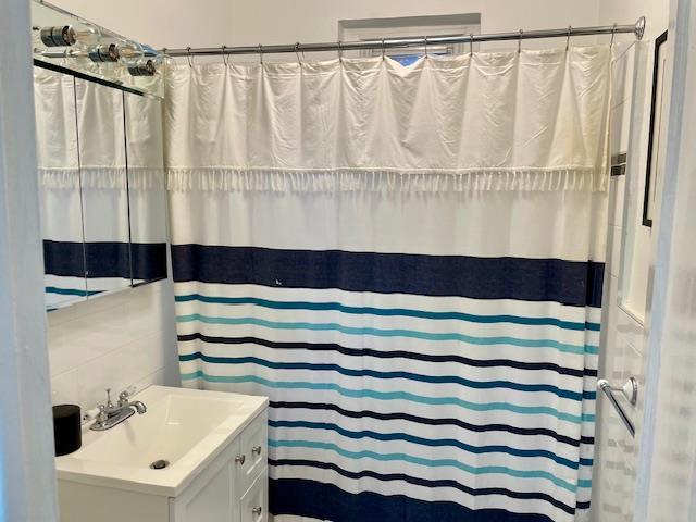 72-17 34th Ave Unit 1H, Jackson Heights, NY 11372 - bathroom with vanity and curtained shower