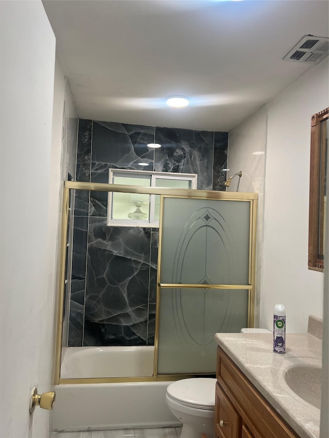20 Rollin Ln, Brentwood, NY 11717 - full bath featuring vanity, toilet, and shower / bath combination with glass door