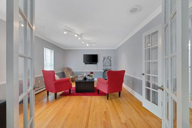 8 Mueller Mountain Rd, Putnam Valley, NY 10579 - living area featuring french doors, wood finished floors, crown molding, and baseboard heating