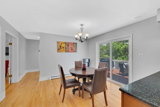 8 Mueller Mountain Rd, Putnam Valley, NY 10579 - dining area featuring a chandelier, light wood finished floors, baseboard heating, and baseboards