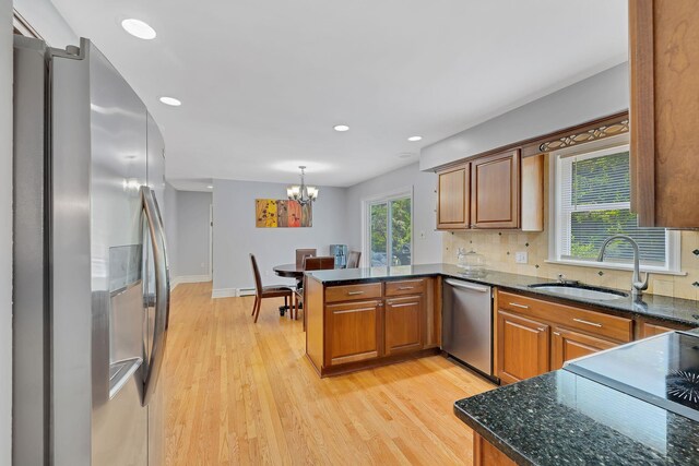 8 Mueller Mountain Rd, Putnam Valley, NY 10579 - kitchen with stainless steel appliances, a peninsula, brown cabinetry, light wood-style floors, and recessed lighting