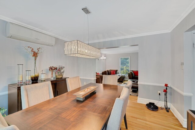 8 Mueller Mountain Rd, Putnam Valley, NY 10579 - dining area with light wood-style flooring, a wall unit AC, crown molding, and baseboards
