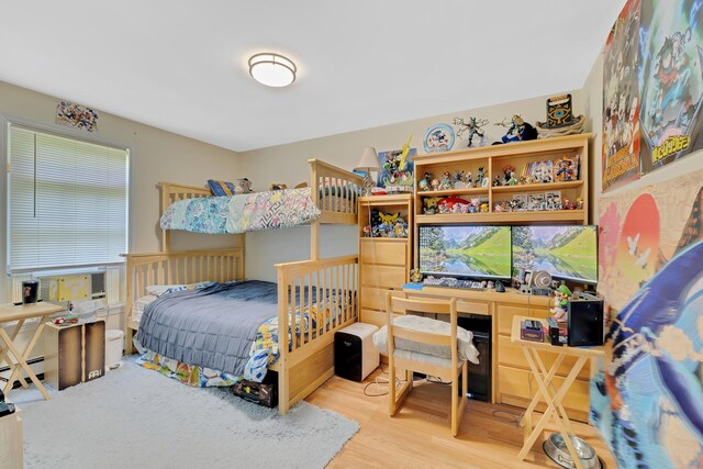 8 Mueller Mountain Rd, Putnam Valley, NY 10579 - bedroom featuring wood finished floors, a baseboard radiator, and cooling unit
