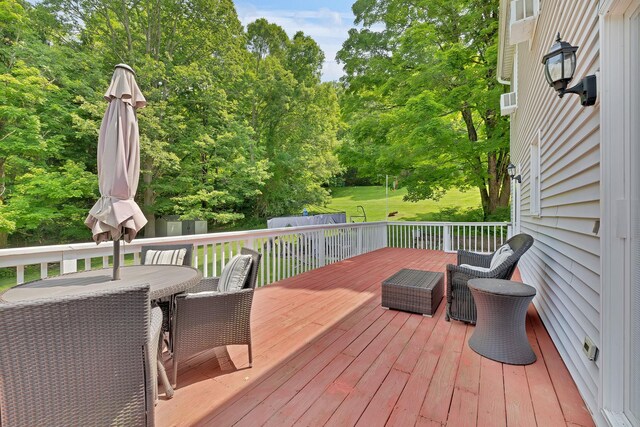 8 Mueller Mountain Rd, Putnam Valley, NY 10579 - wooden terrace with outdoor dining space and view of wooded area