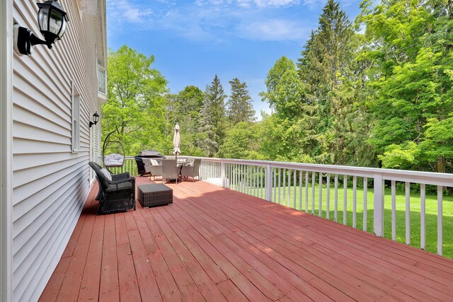 8 Mueller Mountain Rd, Putnam Valley, NY 10579 - wooden deck featuring outdoor dining space, a yard, and view of scattered trees