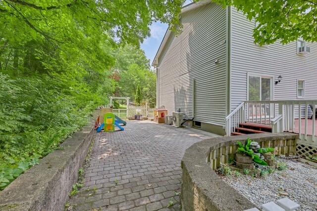 8 Mueller Mountain Rd, Putnam Valley, NY 10579 - view of side of property with a patio and a wooden deck