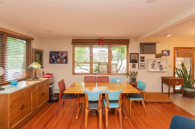 6807 State Route 42, Woodbourne, NY 12788 - dining space with light wood-style floors and a wall unit AC