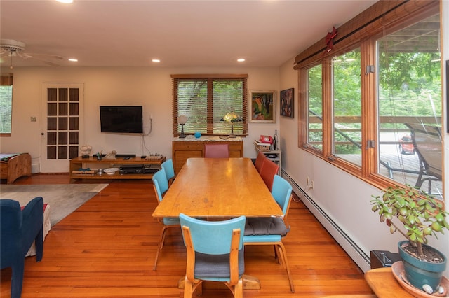 6807 State Route 42, Woodbourne, NY 12788 - dining room featuring recessed lighting, a baseboard heating unit, a ceiling fan, and light wood-style flooring