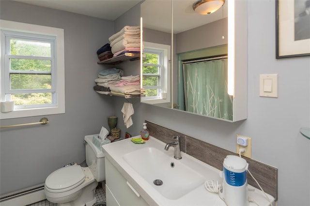 6807 State Route 42, Woodbourne, NY 12788 - full bathroom with a baseboard radiator, plenty of natural light, a shower with curtain, and vanity