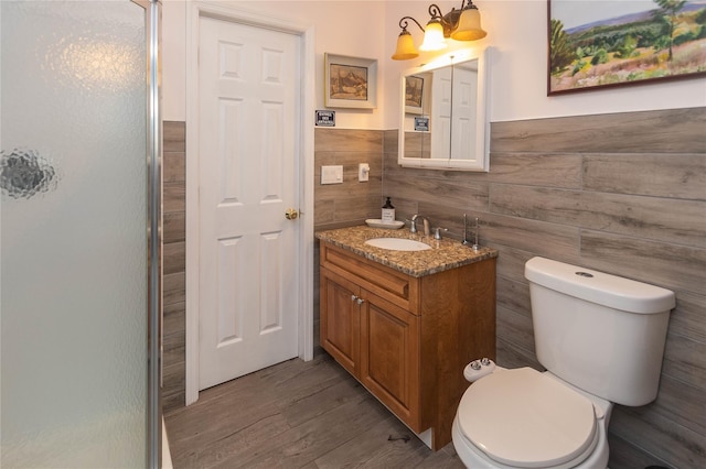 6807 State Route 42, Woodbourne, NY 12788 - full bath with a stall shower, vanity, wood finished floors, a wainscoted wall, and tile walls
