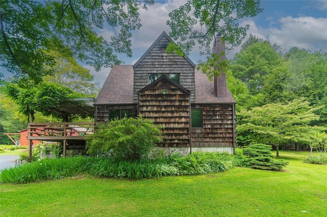 6807 State Route 42, Woodbourne, NY 12788 - view of side of property featuring a chimney, a yard, a deck, and a shingled roof