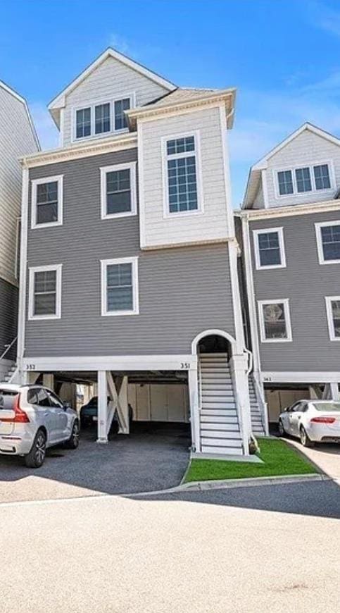 351 Marina Pointe Dr, East Rockaway, NY 11518 - coastal home featuring stairway