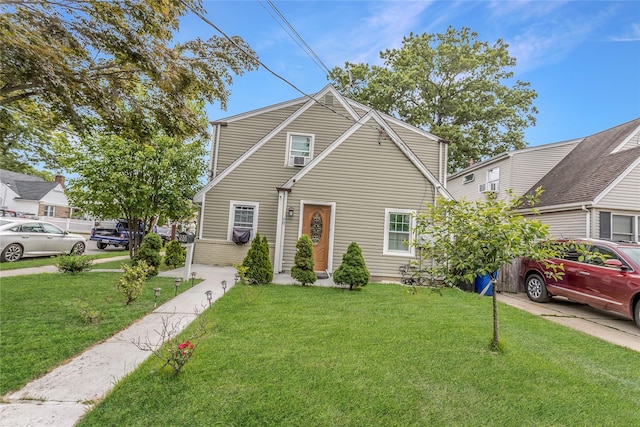 90 Charles St, Lynbrook, NY 11563 - view of front facade with a front lawn