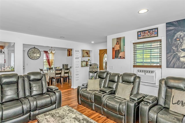 90 Charles St, Lynbrook, NY 11563 - living area featuring wood finished floors, cooling unit, and recessed lighting