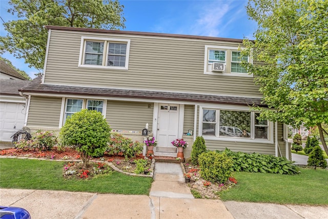 90 Charles St, Lynbrook, NY 11563 - view of front of property with a front yard, cooling unit, and a shingled roof