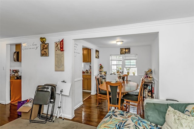 90 Charles St, Lynbrook, NY 11563 - dining room featuring wood finished floors, ornamental molding, and baseboards