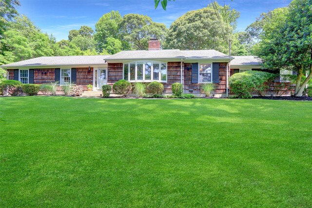 3 Night Heron Dr, Stony Brook, NY 11790 - ranch-style home with a chimney, a front yard, and a shingled roof
