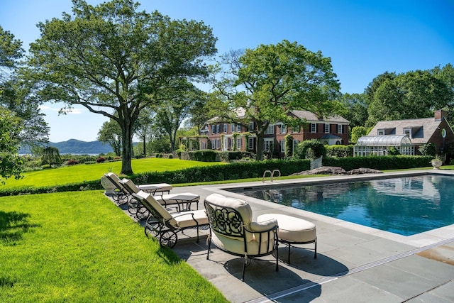 842 Sleepy Hollow Rd, Briarcliff Manor, NY 10510 - swimming pool featuring a yard, a patio area, and a mountain view