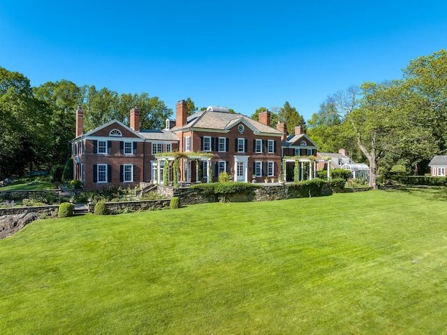842 Sleepy Hollow Rd, Briarcliff Manor, NY 10510 - view of front facade featuring a front yard and a chimney