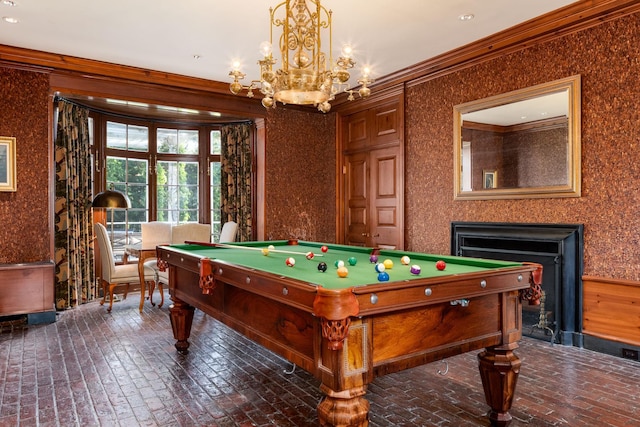 842 Sleepy Hollow Rd, Briarcliff Manor, NY 10510 - playroom featuring brick floors, a chandelier, a fireplace, pool table, and ornamental molding