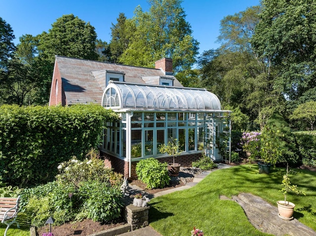 842 Sleepy Hollow Rd, Briarcliff Manor, NY 10510 - back of house featuring a greenhouse, a chimney, a lawn, and an outdoor structure