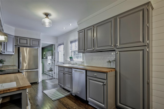 25 Jackwill Rd, East Patchogue, NY 11772 - kitchen with wood counters, appliances with stainless steel finishes, gray cabinetry, tasteful backsplash, and dark wood-type flooring