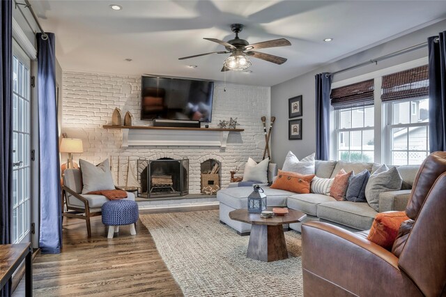 25 Jackwill Rd, East Patchogue, NY 11772 - living area with wood finished floors, a ceiling fan, a fireplace, and recessed lighting