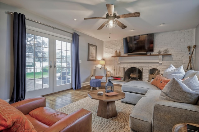 25 Jackwill Rd, East Patchogue, NY 11772 - living area featuring french doors, wood finished floors, a ceiling fan, a fireplace, and recessed lighting