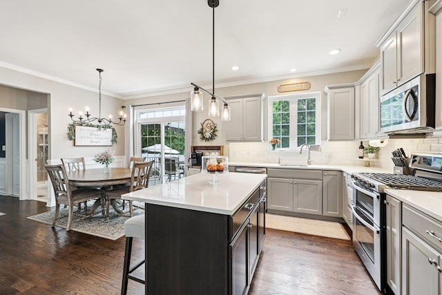 35 Laurel Cir, Goshen, NY 10924 - kitchen featuring stainless steel appliances, backsplash, healthy amount of natural light, crown molding, and recessed lighting