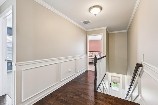 35 Laurel Cir, Goshen, NY 10924 - corridor with an upstairs landing, dark wood-style floors, crown molding, a wainscoted wall, and a decorative wall
