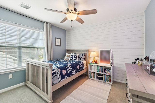 35 Laurel Cir, Goshen, NY 10924 - bedroom featuring carpet floors, wooden walls, and a ceiling fan