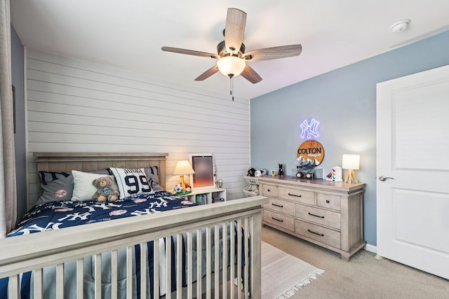 35 Laurel Cir, Goshen, NY 10924 - bedroom featuring light carpet, ceiling fan, and wooden walls
