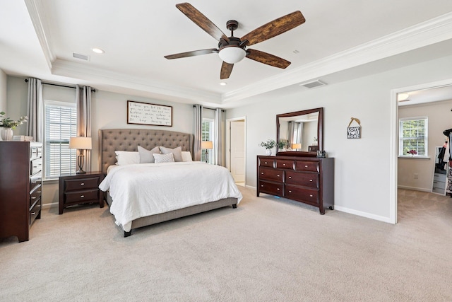 35 Laurel Cir, Goshen, NY 10924 - bedroom featuring a tray ceiling, light colored carpet, crown molding, multiple windows, and recessed lighting