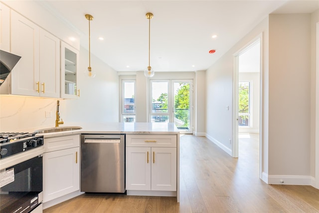 4209 Hampton St Unit 4B, Elmhurst, NY 11373 - kitchen with stainless steel dishwasher, a sink, range with gas stovetop, light wood-style floors, and a peninsula