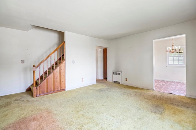 628 8th Ave, New Hyde Park, NY 11040 - unfurnished living room featuring radiator, carpet, a chandelier, and stairs