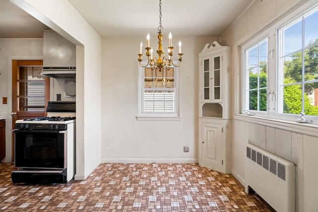628 8th Ave, New Hyde Park, NY 11040 - unfurnished dining area with radiator and a chandelier