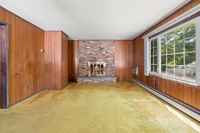 628 8th Ave, New Hyde Park, NY 11040 - unfurnished living room featuring baseboard heating, wood walls, carpet, a brick fireplace, and a wall mounted air conditioner