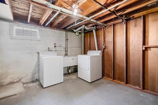 628 8th Ave, New Hyde Park, NY 11040 - unfinished below grade area with separate washer and dryer and a sink
