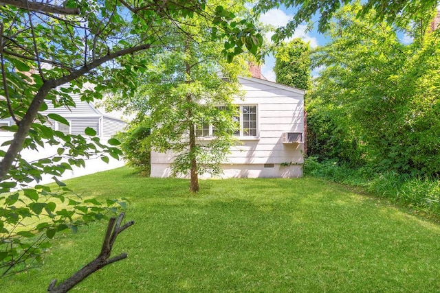 628 8th Ave, New Hyde Park, NY 11040 - view of grassy yard with a wall mounted air conditioner