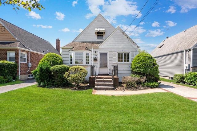 628 8th Ave, New Hyde Park, NY 11040 - view of front of home featuring a front lawn