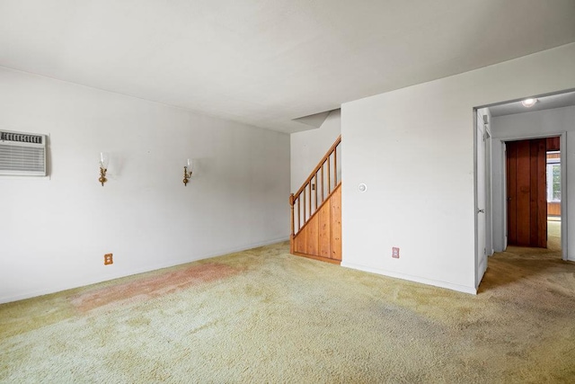 628 8th Ave, New Hyde Park, NY 11040 - spare room with light colored carpet, stairway, and a wall mounted air conditioner