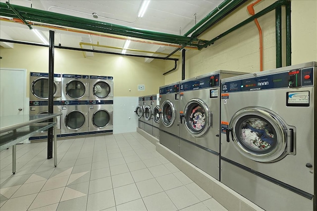 1 Birchwood Ct Unit 1N, Mineola, NY 11501 - communal laundry room with stacked washer / drying machine and washer and clothes dryer