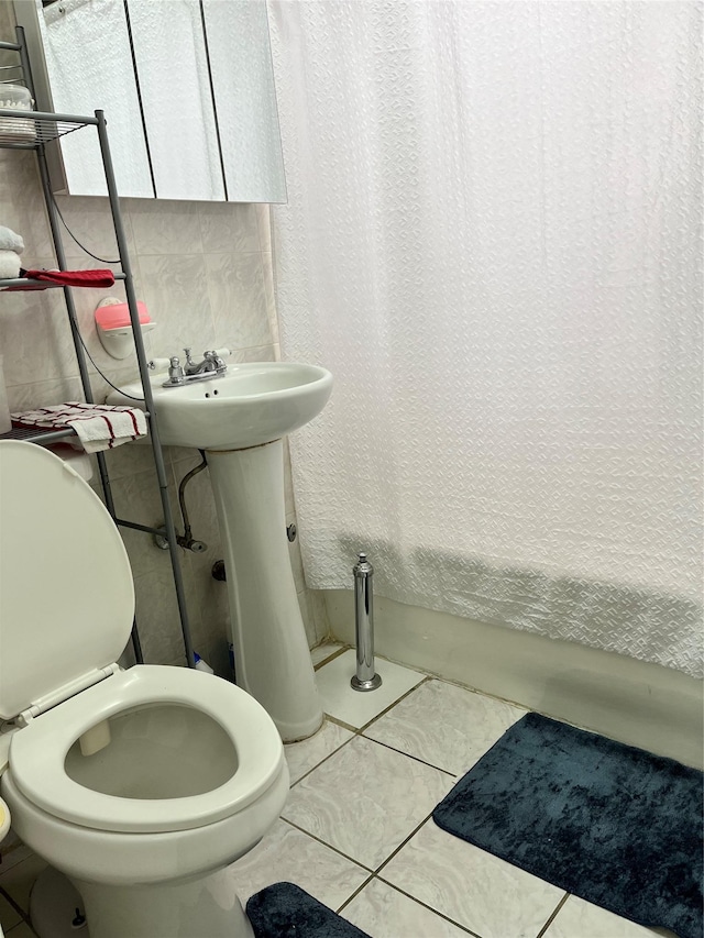 39-82 65th Pl Unit 4F, Woodside, NY 11377 - bathroom with shower / bath combo, toilet, and tile patterned flooring